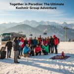 Perfect kashmir group tour packages experience - diverse travel group celebrating together in beautiful Gulmarg winter landscape with professional tour coordination
