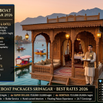 Luxury houseboat packages Srinagar 2026 - royal walnut wood heritage houseboat on Dal Lake at sunset with butler serving Kahwa, deluxe ₹6,000-10,000, super deluxe ₹10,000-15,000, heritage ₹15,000-25,000+ per night