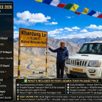 Ladakh tour package price 2026 - white 4x4 SUV at Khardung La 18380 feet with Ladakhi driver and prayer flags, budget land package ₹18,000-30,500 for 12-14 days, standard fixed departure ₹29,500-36,500 for 7-9 days, all-inclusive with flights ₹49,000-67,950 for 7 days, motorcycle tour ₹51,900-1,80,000 for 11-12 days, luxury tour ₹2,78,000-3,30,000 for 11 days