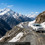 Srinagar Leh Manali circuit package 2026 SUV at Zojila Pass with Himalayan mountains