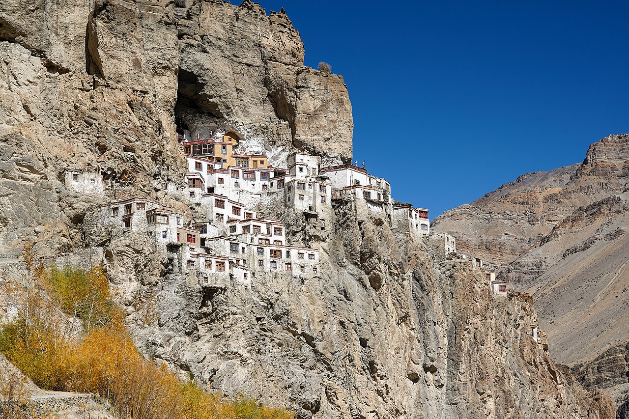 Zanskar valley trek package - Phugtal Monastery built into a cave on a cliff face in Zanskar