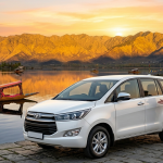 Luxury cab services in Srinagar 2026 - premium Innova Crysta with Dal Lake and Zabarwan mountains
