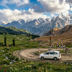 Srinagar to Leh road trip itinerary 2026 - vehicle on winding Himalayan highway with snow-capped peaks