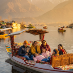 Ahmedabad to Kashmir 6 nights 7 days package 2026 - family enjoying shikara ride on Dal Lake