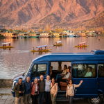 Best Urbania tempo traveller service Srinagar 2026 - luxury Urbania with happy group on Dal Lake at golden hour