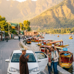 Local taxi Srinagar 2026 - sedan on Dal Lake Boulevard with Kashmiri driver