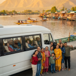 Tempo traveller hire Srinagar 2026 - happy group with comfortable tempo on Dal Lake at golden hour