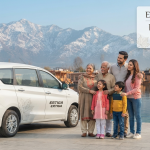 Ertiga cab booking Kashmir for family - happy family with Ertiga at scenic Kashmir location Nature Connect Travels