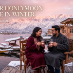 Kashmir honeymoon package in winter - couple in pherans on snow-dusted houseboat deck with Dal Lake and Pir Panjal sunset