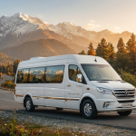Force Urbania luxury tempo van parked on Srinagar highway with Himalayan mountains in background for premium group travel