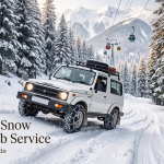 Gulmarg snow chain cab service - 4x4 Gypsy with anti-skid chains driving up snow-covered Tangmarg to Gulmarg road through frosted deodar trees