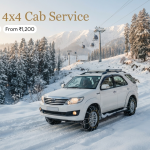 Kashmir 4x4 cab service - 4x4 SUV with snow chains driving up snow-covered Tangmarg to Gulmarg road through frosted deodar trees