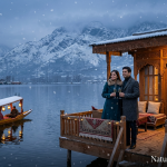 Kashmir luxury honeymoon tour by Nature Connect Travels showing couple on heritage houseboat deck with snowfall