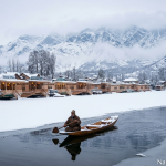 Kashmir winter package by Nature Connect Travels showing snow-covered Dal Lake houseboats and Shikara