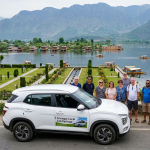 Srinagar local cab package by Nature Connect Travels showing sedan on Dal Lake Boulevard with chauffeur