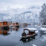 Winter packages Kashmir by Nature Connect Travels showing snow-covered Dal Lake houseboats and Shikara